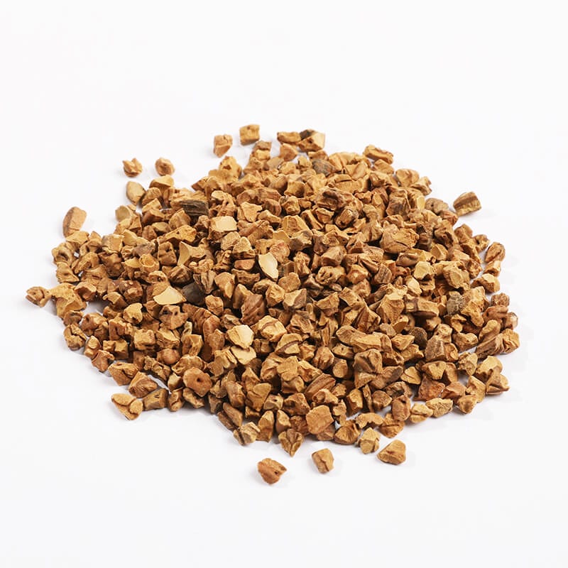 Walnut shell dry tumbling media crushed granules close-up on white background